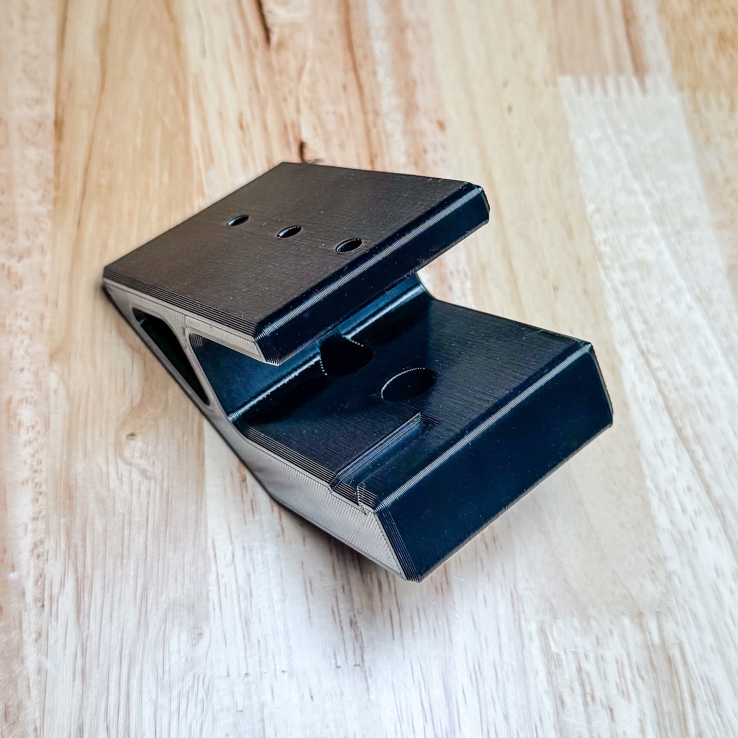 AR-15 rifle wall hanger designed for mil-spec lowers. Secure magwell retention, stud-mounted strength, and durable PETG construction. Made in USA