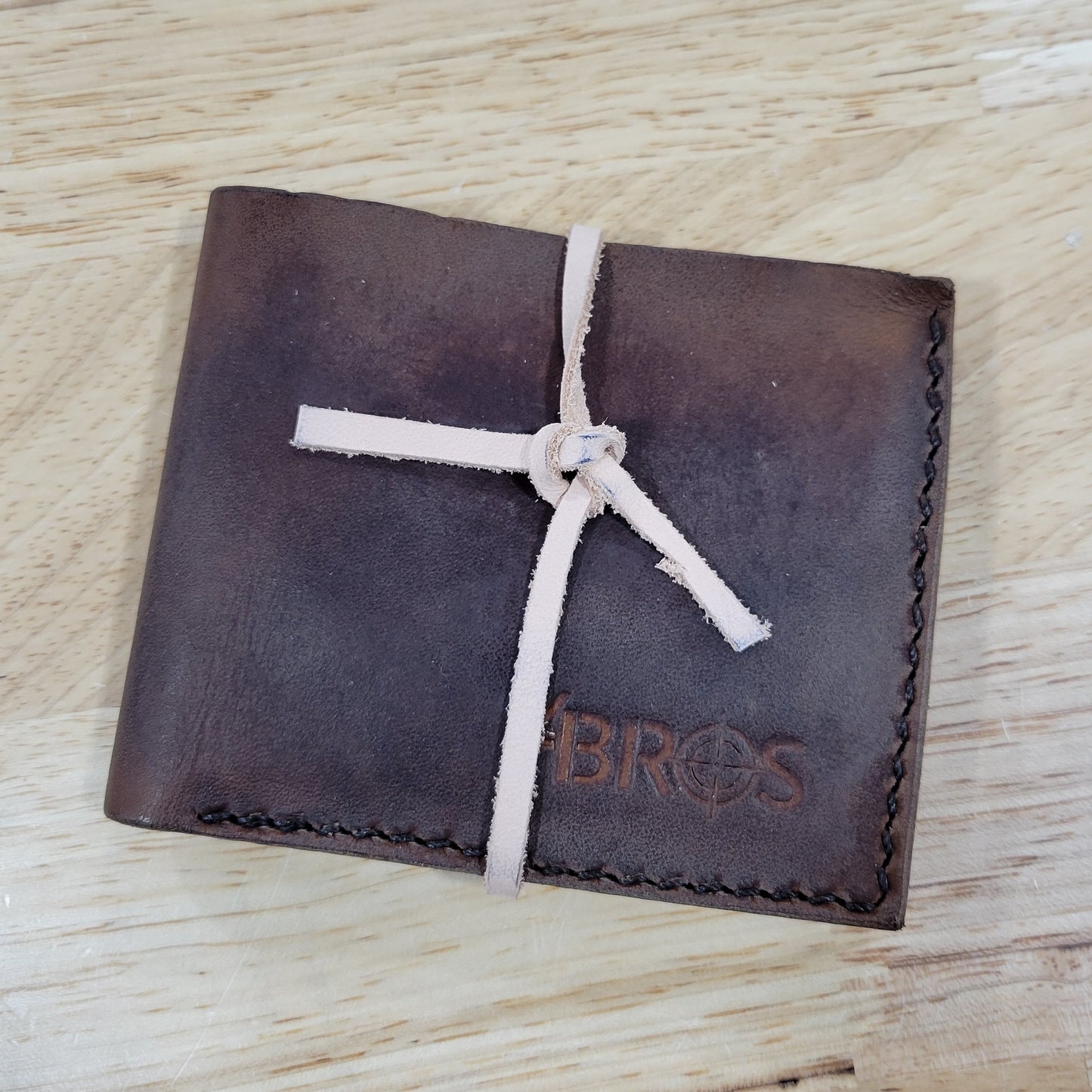 Our 4Bros Wallet is 100% hand-made in Cass County, Indiana. The single-fold design has four pockets on each side, three sized for credit cards, and one hidden pocket behind the card pockets. We use 5-6 ounce leather for the exterior and goat skin for the interior to keep the weight and thickness to a minimum.