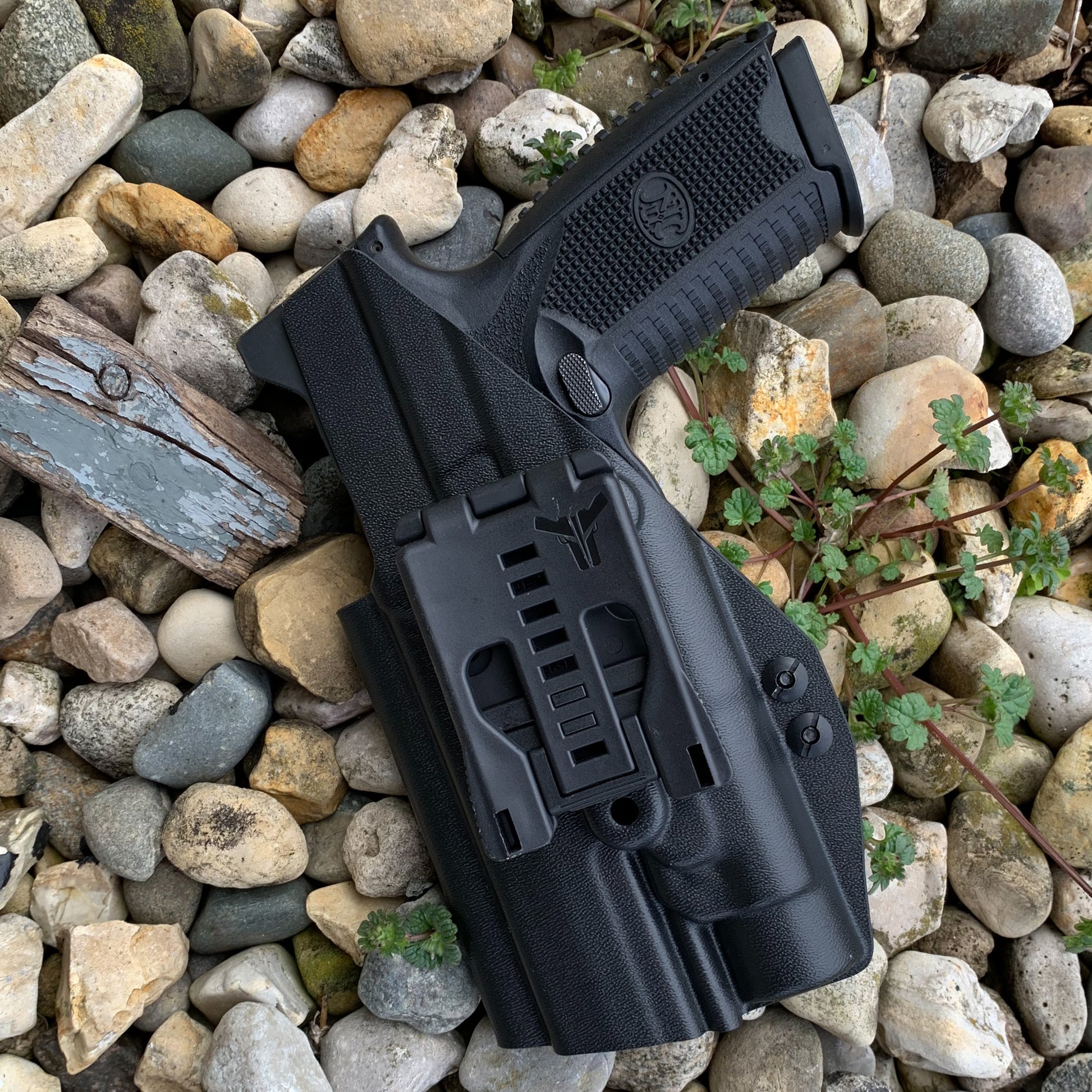 For the best Outside Waistband OWB Holster for the FN 509 Tactical with the Streamlight TLR-1 or TLR-1 HL weapon-mounted light, shop Four Brothers Holsters.