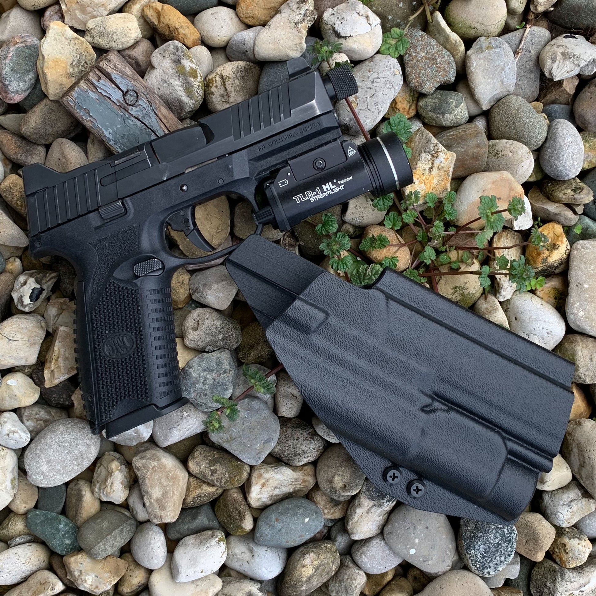 For the best Outside Waistband OWB Holster for the FN 509 Tactical with the Streamlight TLR-1 or TLR-1 HL weapon-mounted light, shop Four Brothers Holsters.