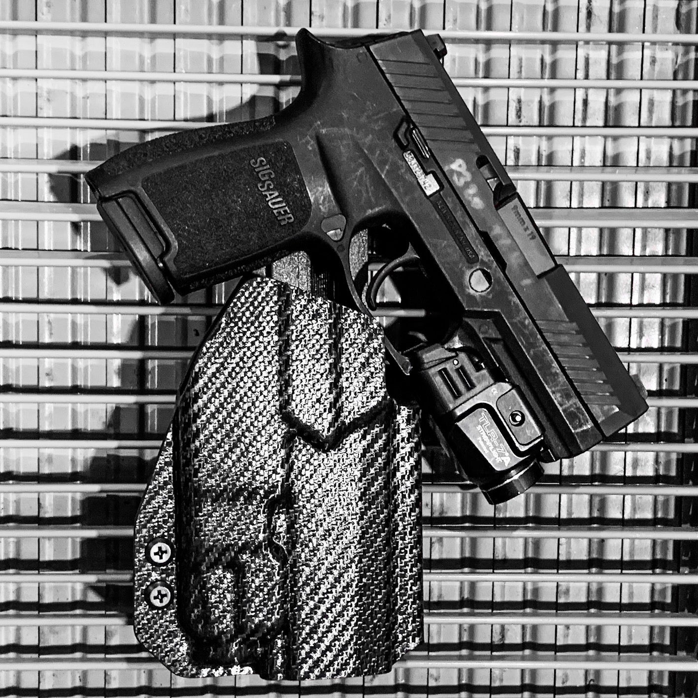 Outside Waistband Holster designed to fit the Sig Sauer P320 Compact, Carry and M18 pistols with the Streamlight TLR-7 or TLR-7A light and GoGuns USA Gas Pedal mounted to the pistol. Holster retention is on the light itself and not the pistol, the holster will not work without the light mounted on the firearm.