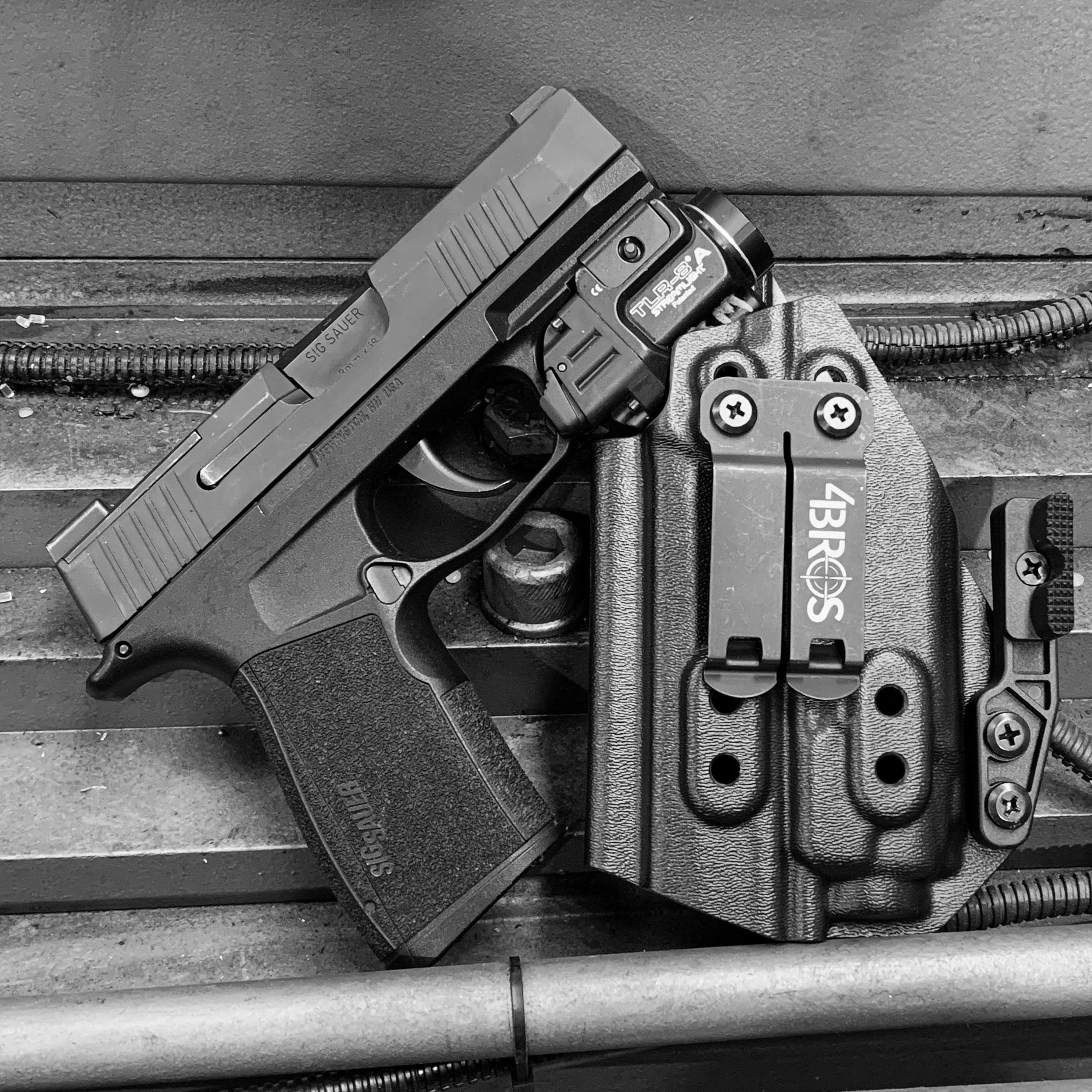 For the best Inside Waistband IWB AIWB Kydex Holster designed to fit the Sig Sauer P365-XMACRO, COMP, and TACOPS  with Streamlight TLR-8 A G, shop Four Brothers Holsters.  Full sweat guard, adjustable retention, and reduced printing. Made in the USA. Open muzzle for threaded barrels, cleared for red dot sights. MACRO