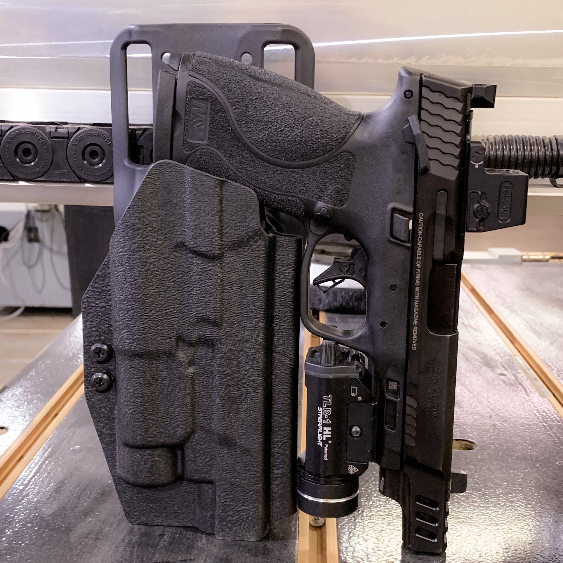 For the best OWB S&W Performance Center M&P M2.0 5.6" 10MM with thumb safety & Streamlight TLR-1 HL Duty & Competition Holster, shop Four Brothers Holsters.