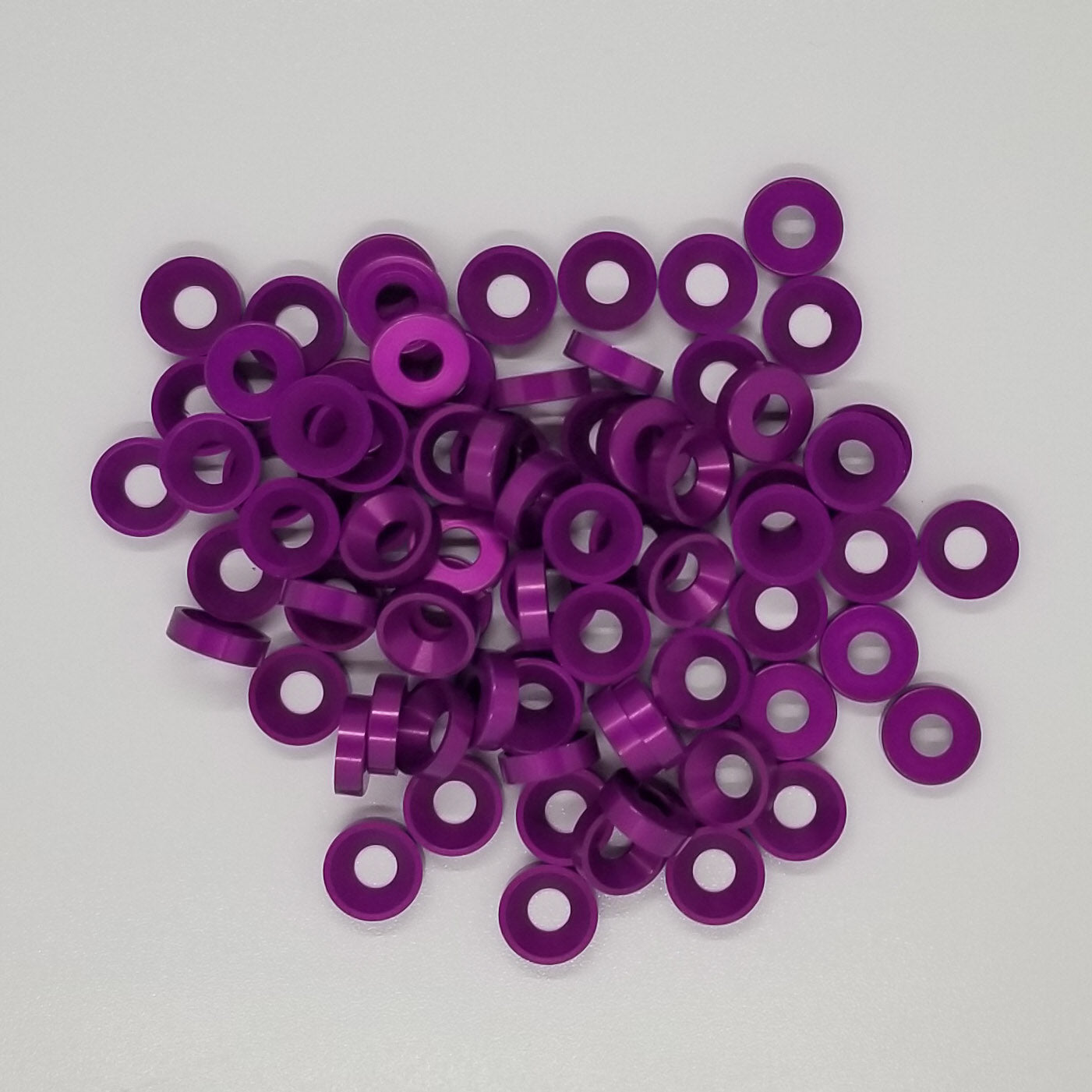 #8 Aluminum Purple Anodized per military specs Finish Washer Machined & Chamfer cut for a standard #8 flat head cap screw or #8 truss head screw. Made in USA