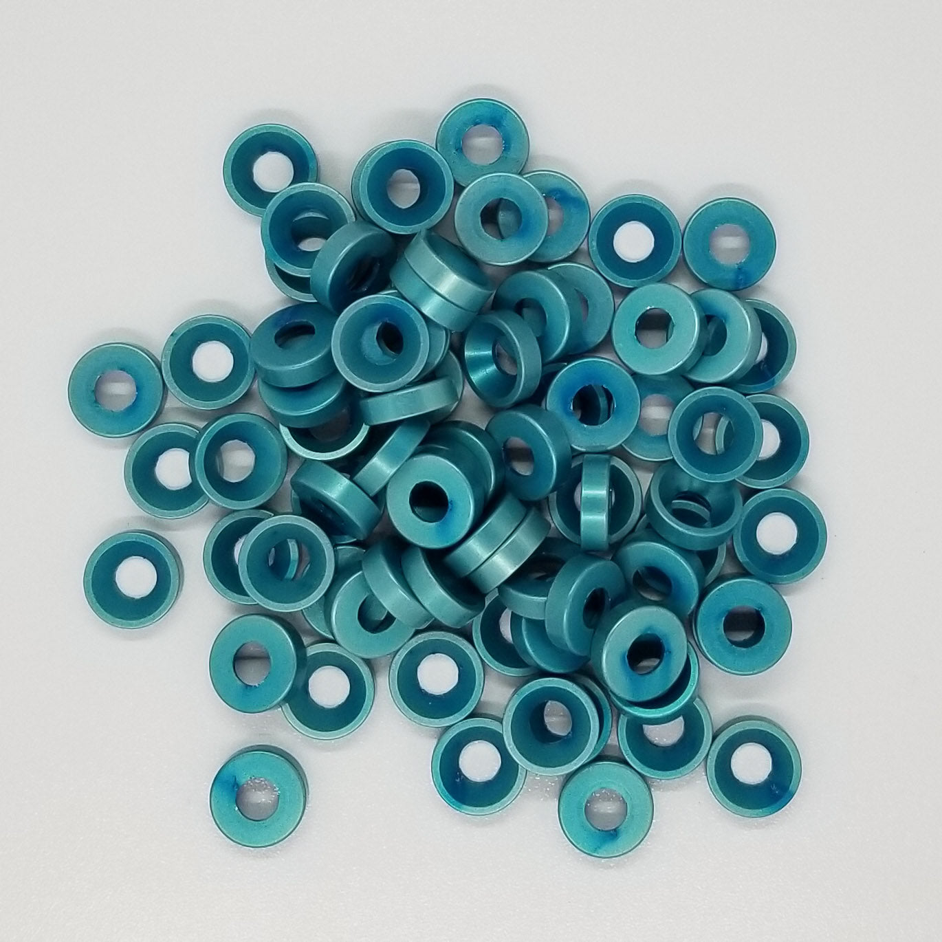 #8 Aluminum Teal Anodized per military specs Finish Washer Machined & Chamfer cut for a standard #8 flat head cap screw or #8 truss head screw. Made in USA