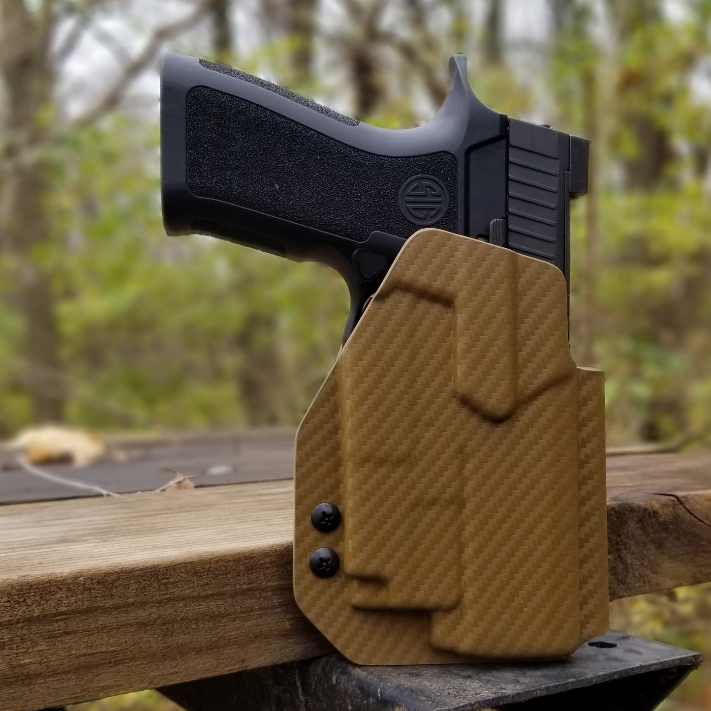 For the best Outside Waistband OWB Holster for the Sig Sauer P320 Carry, Compact or P320 M18 & Olight PL-Mini 2 with Gas Pedal CG shop Four Brothers Holsters.