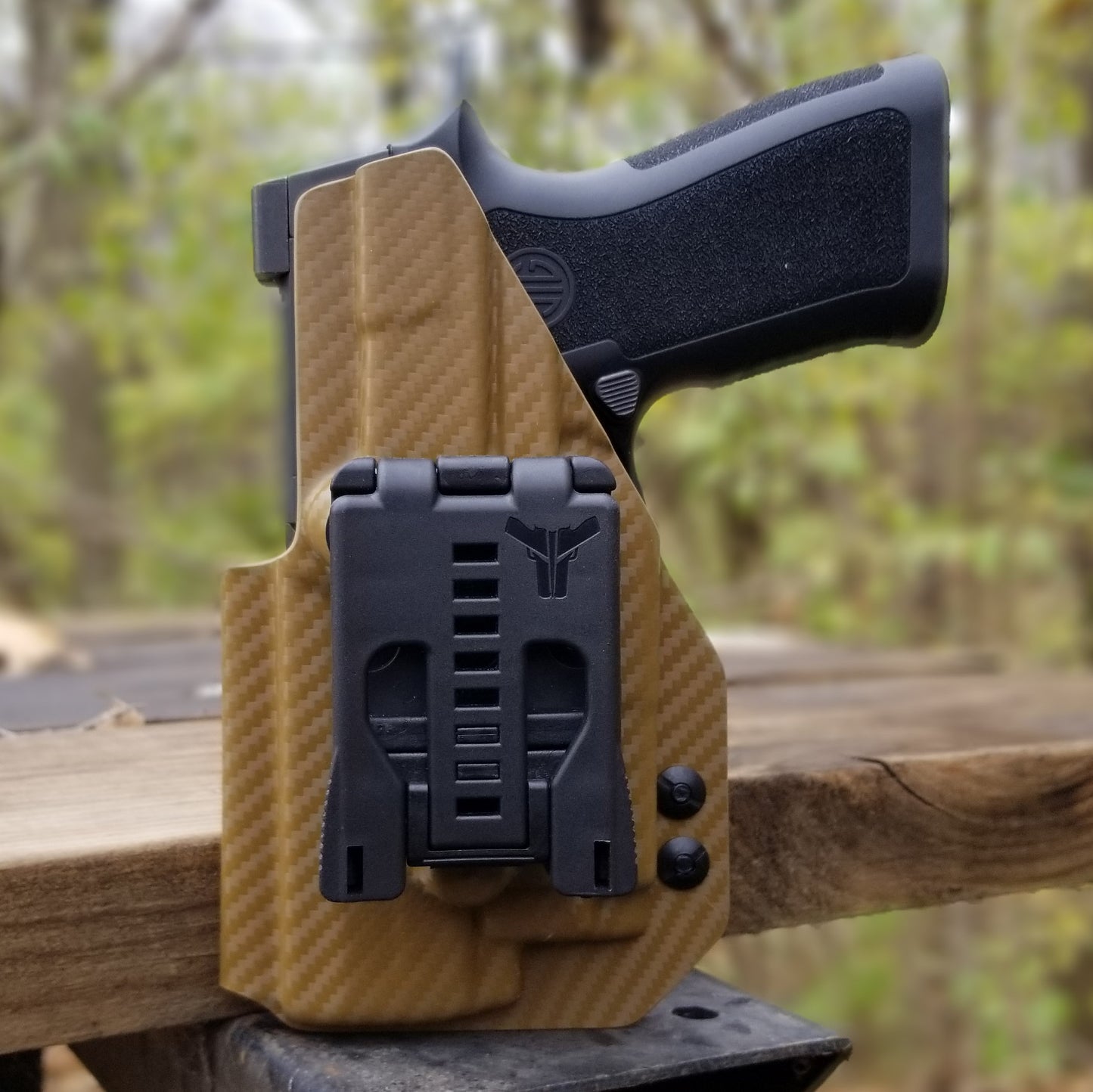 For the best Outside Waistband OWB Holster for the Sig Sauer P320 Carry, Compact or P320 M18 & Olight PL-Mini 2 with Gas Pedal CG shop Four Brothers Holsters.