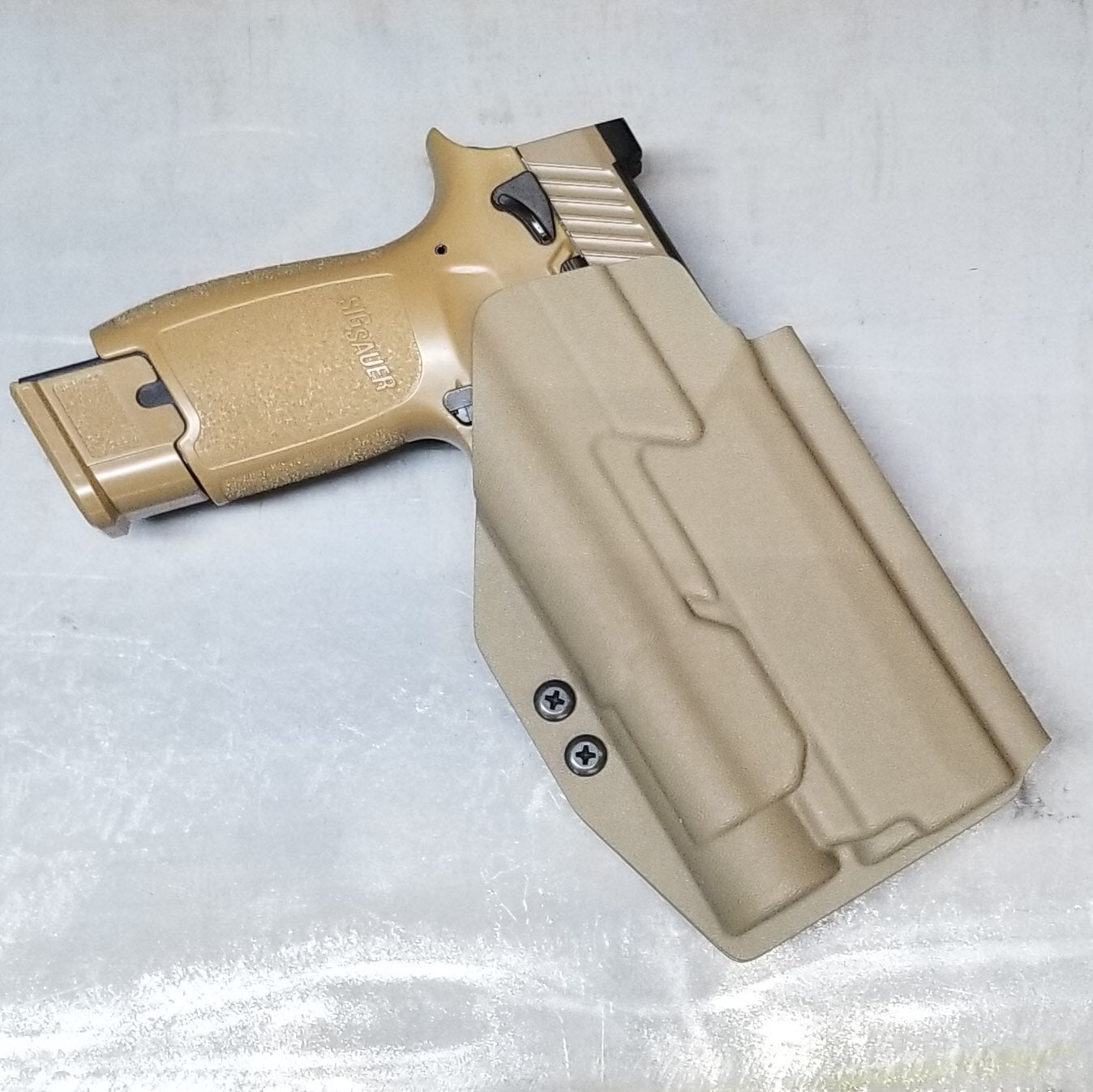 For the best OWB Holster for the Sig Sauer P320 Full Size, Carry, Compact, M17, M18, X-Five or X5 pistol & Streamlight TLR-1, shop Four Brothers Holsters.