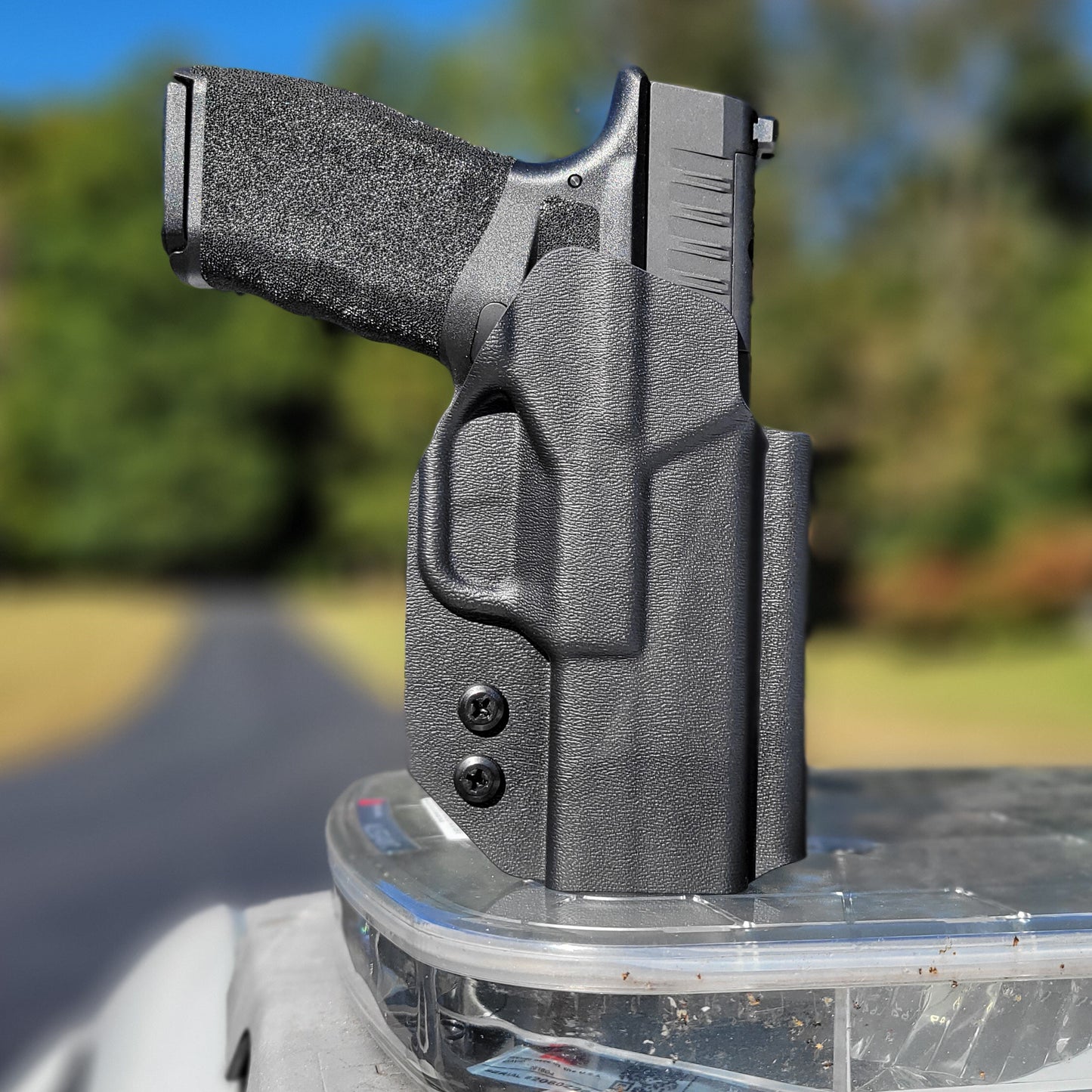 For the best Outside Waistband OWB Holster for the Springfield Armory Hellcat Pro handgun with or without a red dot sight shop Four Brothers 4BROS Holsters.