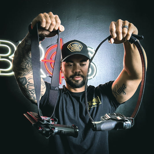 A person carrying two belts.