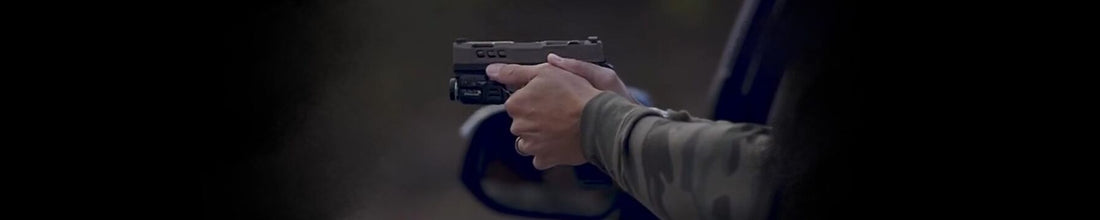 Car carry with a firearm out the window.