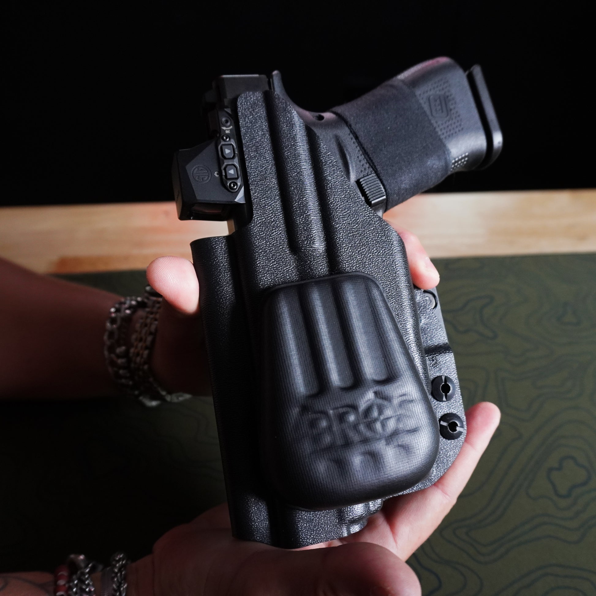 Close-up of an IWB holster with the 4Bros Holster Wedge installed