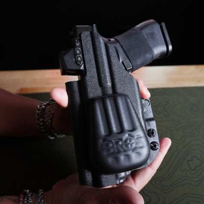 Close-up of an IWB holster with the 4Bros Holster Wedge installed