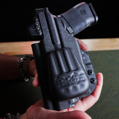 Close-up of an IWB holster with the 4Bros Holster Wedge installed