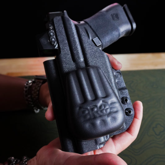 Close-up of an IWB holster with the 4Bros Holster Wedge installed