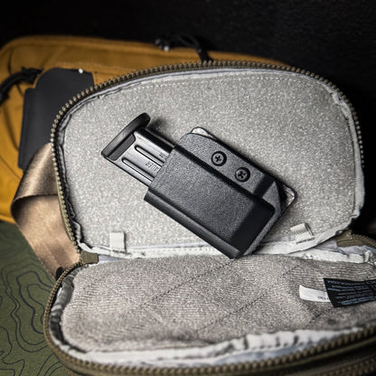 Hook and Loop magazine and accessory mount for backpacks and sling bags. Fits Velcro-compatible panels for secure off-body EDC carry. Made in the USA