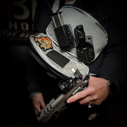Hook and Loop magazine and accessory mount for backpacks and sling bags. Fits Velcro-compatible panels for secure off-body EDC carry. Made in the USA