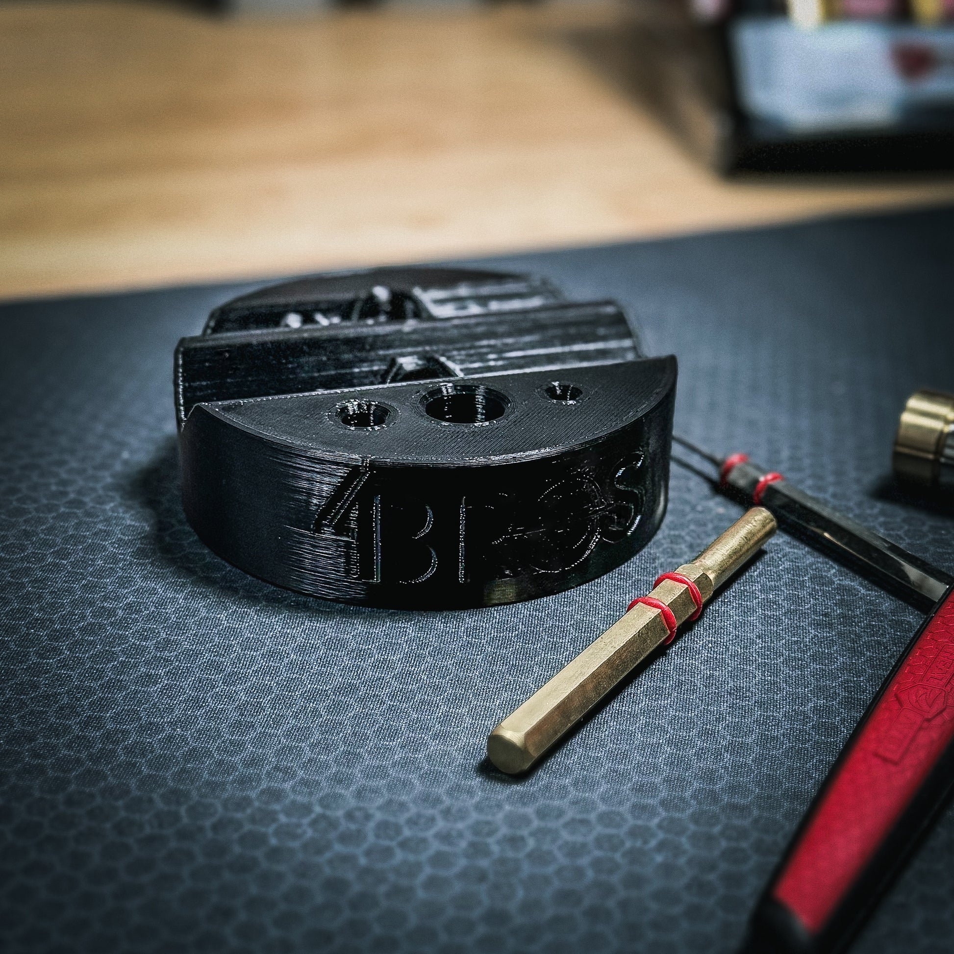 Armorer & Gunsmith 3D-printed Universal Bench Block from Four Brothers Holsters makes the removal of pins from firearms & devices simple, easy, and quick.