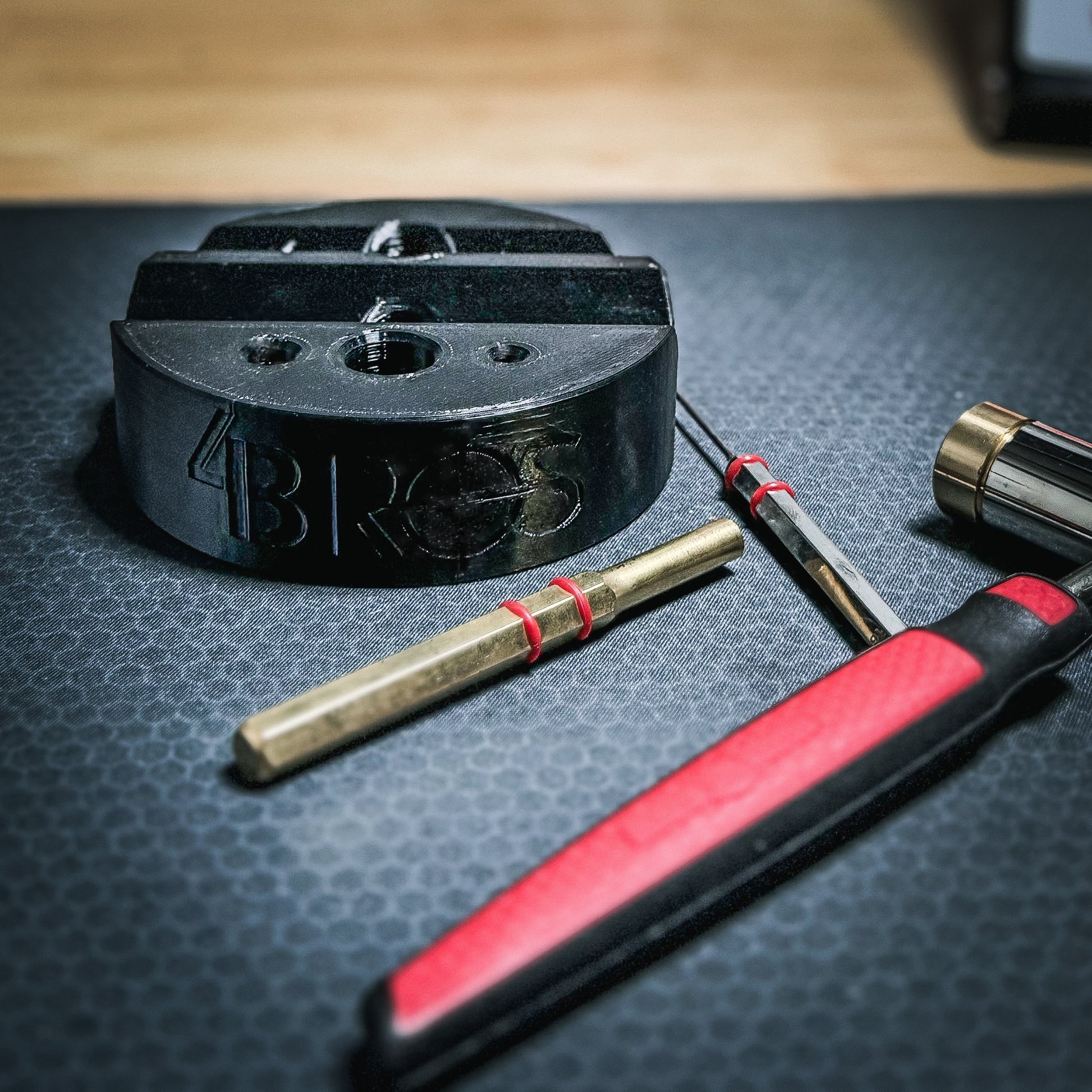 Armorer & Gunsmith 3D-printed Universal Bench Block from Four Brothers Holsters makes the removal of pins from firearms & devices simple, easy, and quick.