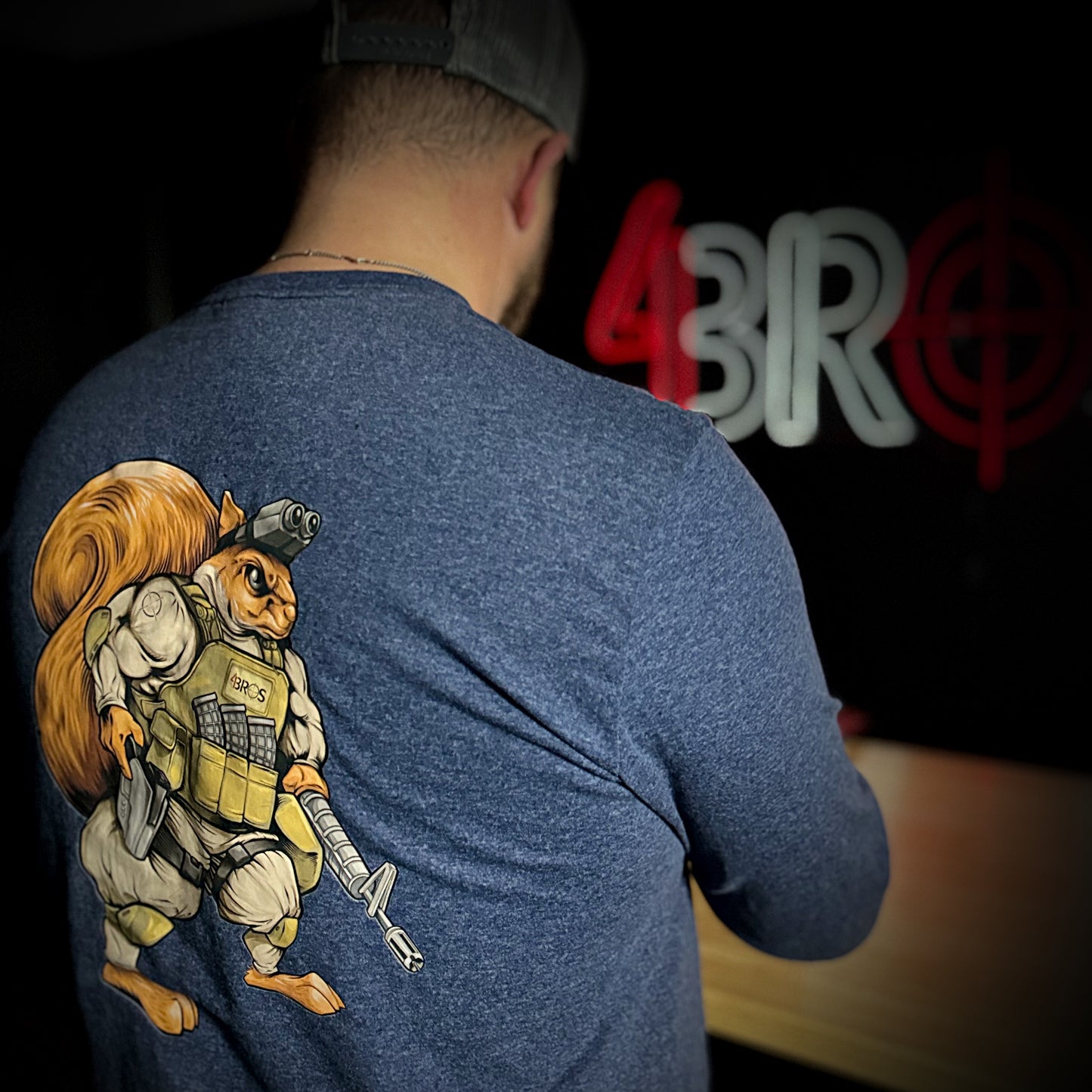 Show off your wild side with the 4Bros Holsters "Dirt the Squirrel" long-sleeve tee! Soft, stylish, and durable, it's perfect for adventures or casual wear. 