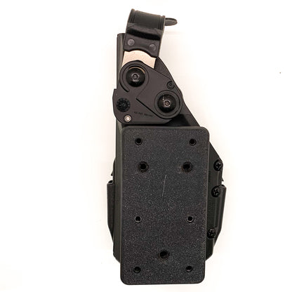 For the best Molle Adapter designed to fit the Safariland Taser 7 holster, shop Four Brothers 4BROS Holsters. Adjustable cant.  Proudly made in the USA.