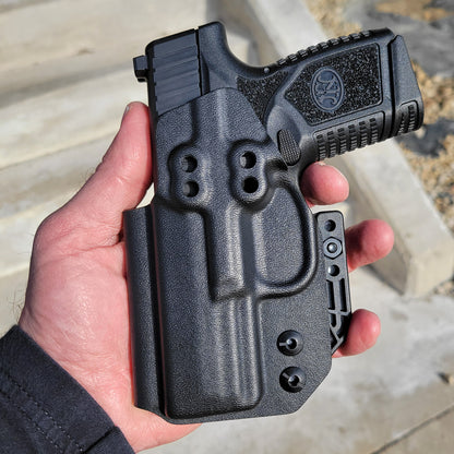 For the best, most comfortable and compact concealed IWB AIWB inside waistband holster designed for the FN Reflex pistol shop Four Brothers Holsters. Our holsters are vacuum formed with a precision machined mold designed from a CAD model of the actual firearm. Suitable for pocket carry. Made in the USA. FN REFLEX