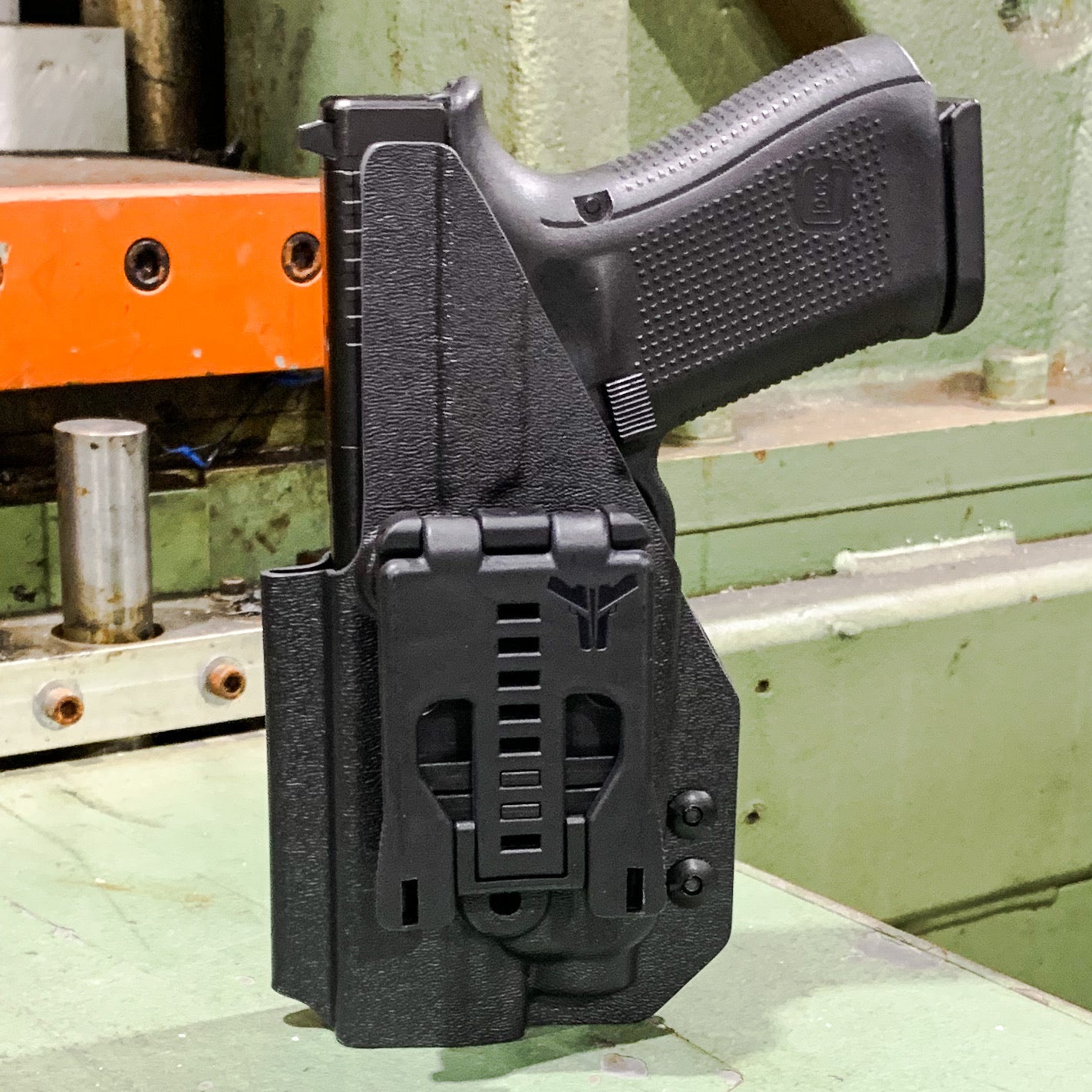 Outside Waistband Kydex holster designed to fit the Glock Gen 5 with the 19 length slide and the Streamlight TLR-7 or TLR-7A light. Full sweat guard, adjustable retention, profiled for a red dot optic. Minimal material and smooth edges to reduce printing. Proudly made in the USA. 