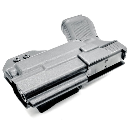 For the best Outside Waistband OWB Holster for the Glock 19, 23, 32, 19X, or 45 with the Nightstick TCM-550XL or TCM-550XLS shop Four Brothers 4BROS Holsters.