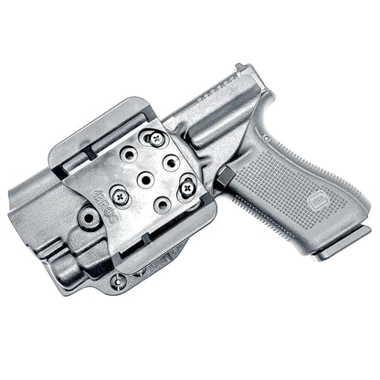 Glock 17 with TLR-7 HL-X outside waistband holster in black with 4BROS 1.5" Slide