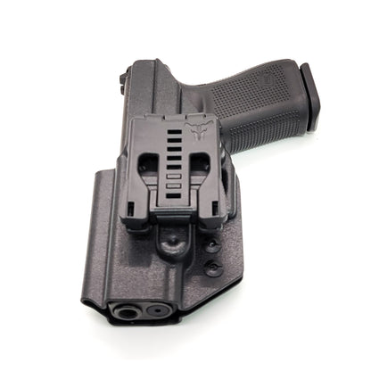 For the best, OWB, Outside Waistband Taco Style Holster of 2023 designed to fit the Glock 19 Gen 5 pistol. The holster will also fit the Gen 3, 4, and 5 Glock 19, 19X, 19 MOS, Gen 3 and 4 Glock 23, Glock 45, 45 MOS, Gen 5 9mm MOS models, and 32, 32 Gen 4. Open Muzzle, cleared for red dot sights. Made in the USA.