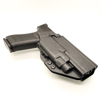 For the best Outside Waistband OWB Kydex holster designed to fit the Glock Gen 5 34 and 34 MOS with the Streamlight TLR-7 HL_X, TLR-7 X, & TLR-7 A, shop Four Brothers 4BROS holsters. Full sweat guard, adjustable retention, holster profile cut for red dot sights. Smooth edges for comfort and concealment. Made in the USA