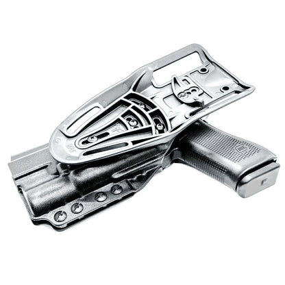 Black OWB Duty & Competition holster for the Glock 34 and Surefire X300 shown with Duty Drop attachment.