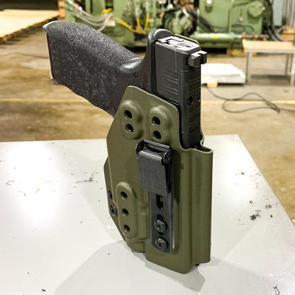 Inside Waistband Holster designed to fit the Springfield Hellcat Pro pistol with the Streamlight TLR-7 Sub 1913 light mounted to the handgun. The holster retention is on the light itself and not the pistol. Full sweat guard, adjustable retention, minimal material and smooth edges to reduce printing. Made in the USA.