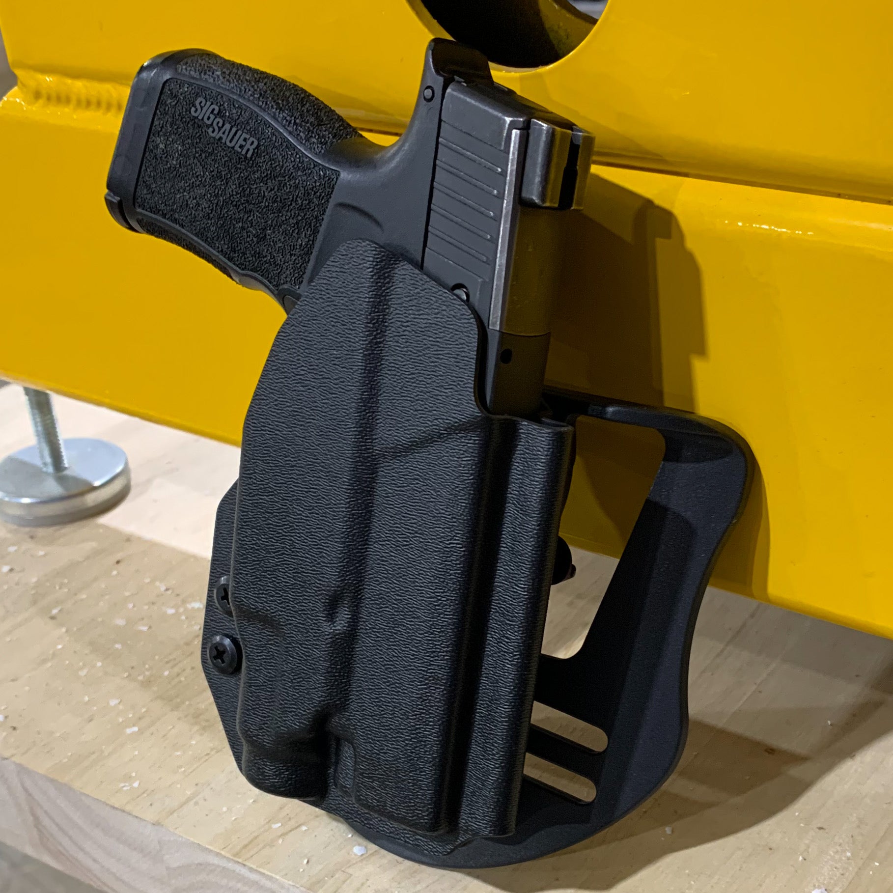 Outside Waistband Holster designed to fit the Sig Sauer P365XL pistol with the Streamlight TLR-7 Sub light mounted to the handgun. Full sweat guard, adjustable retention, minimal material and smooth edges to reduce printing. Made in the USA.