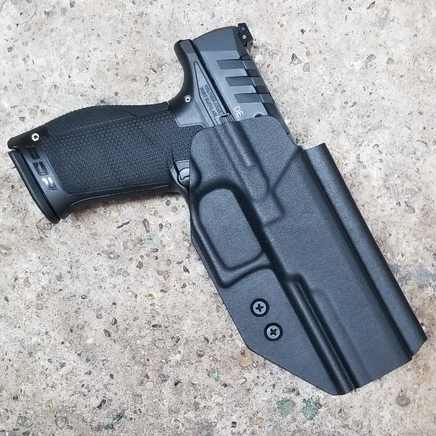 Outside Waistband Holster designed to fit the Walther PDP Compact pistol. Holster profile is cut to allow red dot sights to be mounted on the pistol.  Holster features full sweat guard, adjustable retention and open muzzle for threaded barrels and compensators.