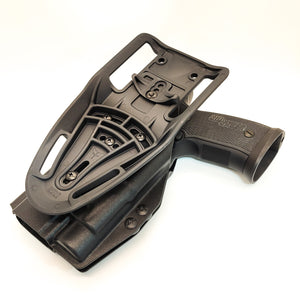 Outside Waistband Competition and Duty Holster designed to fit the Full Size and Carry P320 series with Streamlight TLR-1 and TLR-1HL weapon mounted light and Align Tactical Thumb Rest Takedown Lever. The holster will accommodate the M17, M18, Carry, Compact, & X-Five models with our competition belt mounting options. 