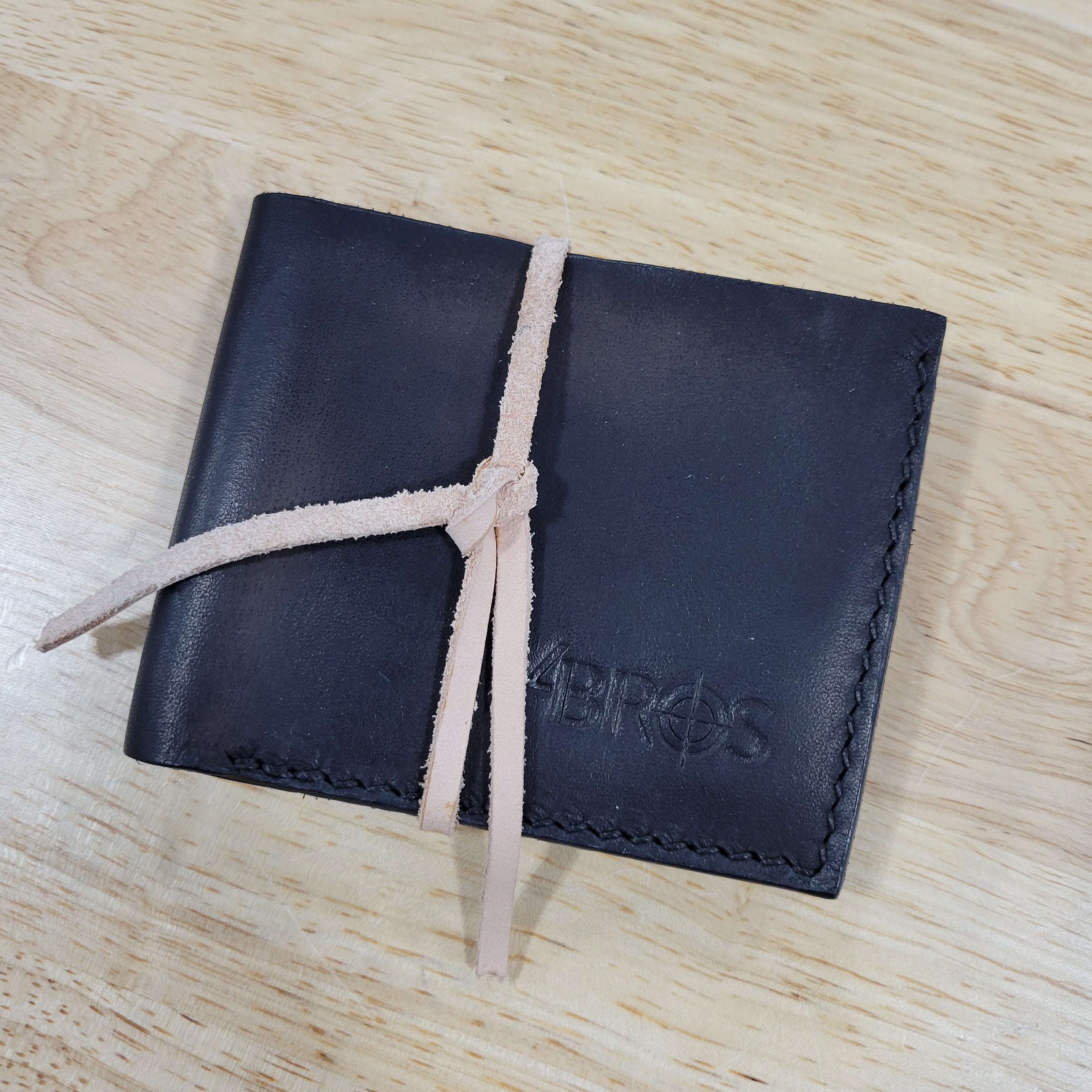 Our 4Bros Wallet is 100% hand-made in Cass County, Indiana. The single-fold design has four pockets on each side, three sized for credit cards, and one hidden pocket behind the card pockets.  We use 5-6 ounce leather for the exterior and goat skin for the interior to keep the weight and thickness to a minimum.