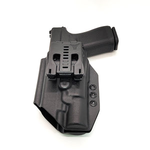 For the best, OWB Outside Waistband Taco Style Holster designed to fit the Glock 19 Gen 5 with the Surefire X300U A or B X300U-A or X300U-B weapon-mounted light, shop Four Brothers Holsters. Adjustable retention, high sweat guard, minimum material for reduced printing. Profiled for red dot sights. Made in the USA.