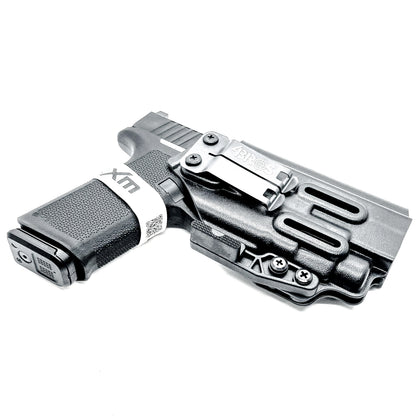 For the Best, most comfortable Inside Waistband IWB AIWB Appendix Kydex holster for the Ruger RXM 4.5" & the Streamlight TLR-7 HL-X, X or A shop Four Brothers