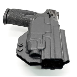 For the best, Outside Waistband OWB Kydex Taco Holster designed to fit the Smith & Wesson M&P 4" 10mm M2.0 pistol with thumb safety & TLR-8A handgun, shop Four Brothers Holsters.  Full sweat guard, adjustable retention, profiled for a red dot sight.  Proudly made in the USA for veterans and law enforcement.