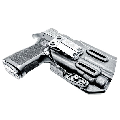 Inside Waistband IWB AIWB holster for the Sig Sauer P320 Compact/Carry pistol & Streamlight TLR-7 HL-X .  Shown in black with the DCC Monoblock and a Modwing.