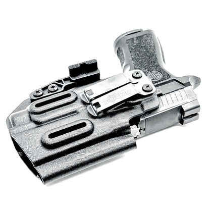 Inside Waistband IWB AIWB holster for the Sig Sauer P320 Compact/Carry pistol & Streamlight TLR-7 HL-X .  Shown in black with the DCC Monoblock and a Modwing.