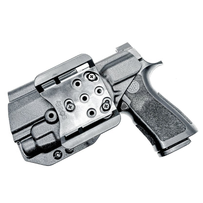 Black Outside Waistband OWB Holster for the Sig Sauer P320 Compact or Carry pistol and a Streamlight TLR-7 HL-X shown with the 4BROS 1.5" Belt Slide.