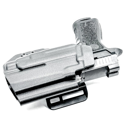 Black Outside Waistband OWB Holster for the Sig Sauer P320 Compact/Carry pistol and a Streamlight TLR-7 X or HL-X & Align Tactical Thumb Rest shown with a 4BROS 1.5" Belt Slide.
