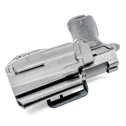 Black Outside Waistband OWB Holster for the Sig Sauer P320 Compact or Carry pistol and a Streamlight TLR-7 X or A shown with the 4BROS 1.5" Belt Slide.