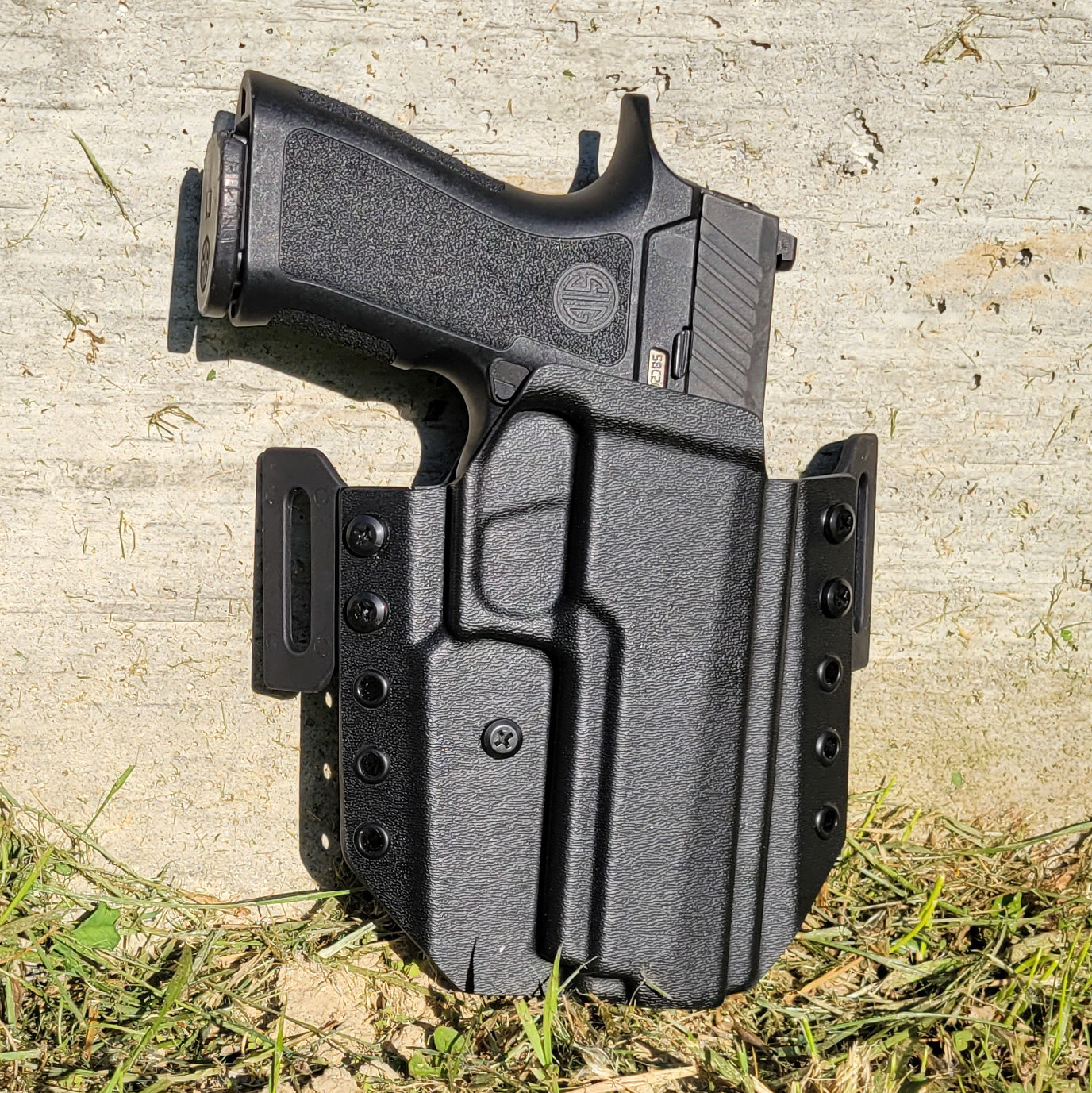 For the 2023 Best Outside Waistband Pancake Style Kydex holster designed to fit the Sig Sauer P320, shop Four Brothers Holsters  Full sweat guard, adjustable retention, open muzzle, cleared for a red dot sight. Made in the USA P320 Full Size, X5 X-FIVE, M17, M18, Carry, XCarry, XCompact, and Compact. Cant and Concealed