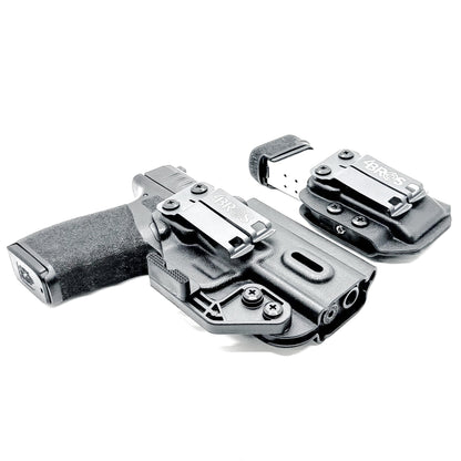 Black holster and magazine pouch set for the  Springfield Armory Hellcat Pro in black form Four Brothers Holsters.