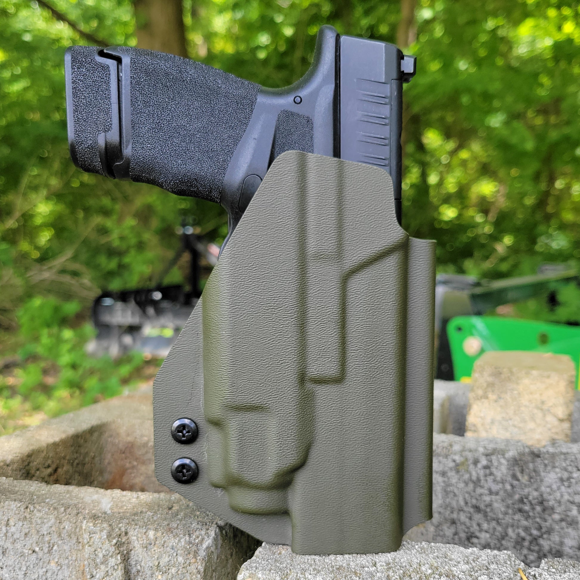 For the best Outside Waistband OWB Holster for the Springfield Hellcat Micro Compact or Hellcat RDP pistol & Streamlight TLR-8 Sub, shop Four Brothers Holsters.