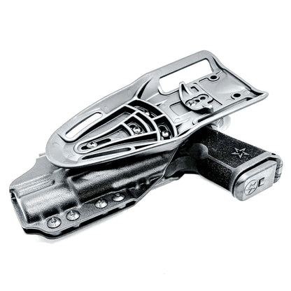 Precision-fit OWB outside the waistband duty & competition holster for the Staccato HD C4X and Surefire X300 from Four Brothers. Made in the USA. Shown In black with a Duty Drop attachment.