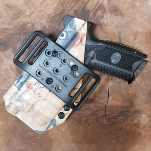 Best Outside Waistband Taco Style Holster for the FN 509 compact, 509 and 509 Tactical with the Streamlight TLR-7 Adjustable retention High sweat guard standard, medium and low height available on request.